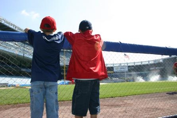 TEAM:New York Yankees CITY:New York STADIUM:Yankee Stadium   Two young guys picturing themselves playing in the House that Ruth Built. Great view from the dugout on a private stadium tour.