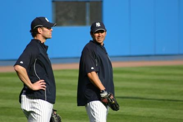 TEAM:New York Yankees CITY:New York STADIUM:Yankee Stadium   Johnny Damon snagging balls during batting practice.