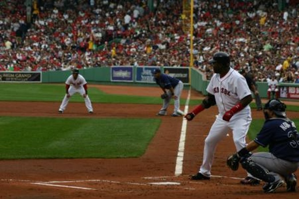 TEAM:Boston Red Sox CITY:Boston STADIUM:Fenway Park   Big Papi at bat with Pedroia on first.